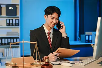 Image of Man holding a phone to his ear