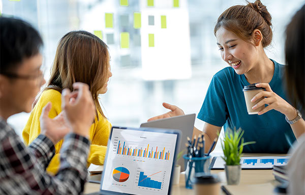 Image of A group of colleagues is collaborating in a modern office setting