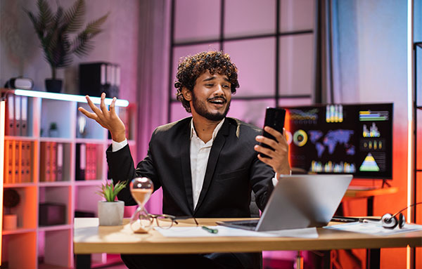 Image of Man looking at his phone