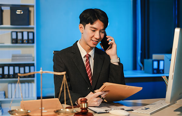 Image of Man holding a phone to his ear